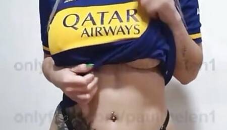 Blonde in a soccer jersey moans while rubbing her nipples