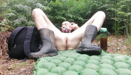 Guy nude outside legs spread with cock rings