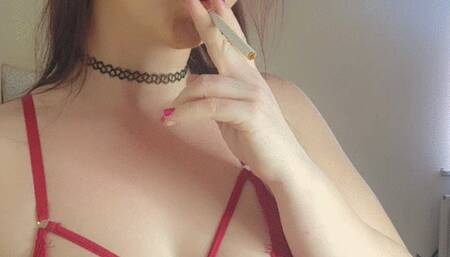 Smoking in my red bodysuit showing my ass