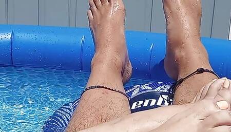 Showing off our pedicured toes in the back yard pool