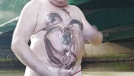 Fat pig Pascal masturbates in the humidity and mud under a bridge