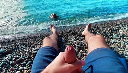 Skinny twinky sucked the big of a stranger jerking off to him on a public beach