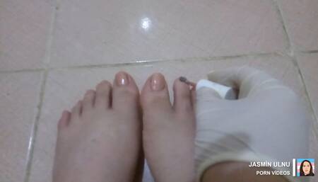 I put light pink nail polish on my shemale feet.
