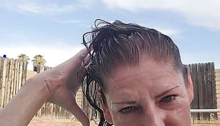 Naked swimming and smoking mature woman