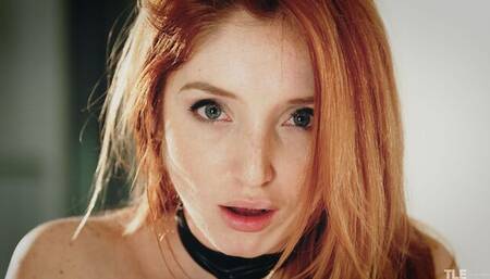 Redhead chick Michelle H is jumping on a huge black sex toy