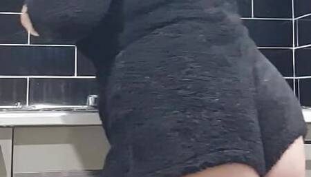 Housewife cleaning kitchen voyeur