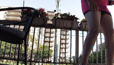 Mature BBW Sissy TV takes a big risk on the balcony wearing  heels and mini dress