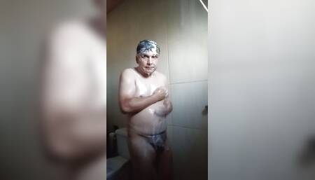 Washing away the rest of cum stuck to the hair in the sack