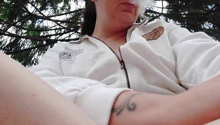Smoking in a Public Garden Tits Outside and Feet in Flip Flops