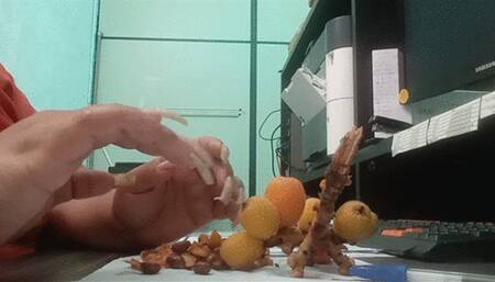 Eating fruit using long nails