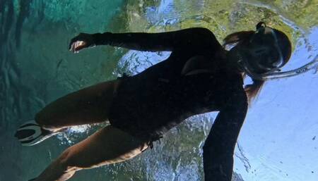 Final swim in the Blue Hole with sunlight and cleavage