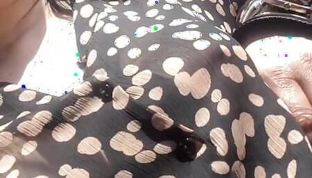 Hot milf with big tits and see-through jacket walks in a public place