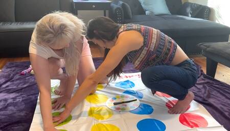 Two hot lesbians are playing a strip twister game