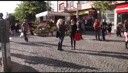 Blonde woman in black lingerie banging on the bed