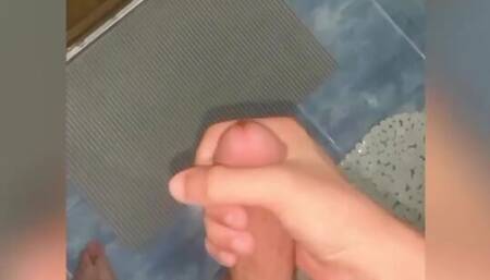 A young boy masturbates and shakes his dick
