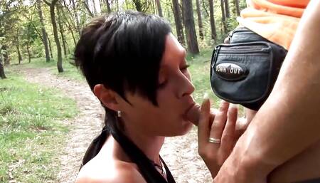 Busty brunette is satisfying her bf outdoors