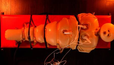 Isabel Love in inflatable latex sack