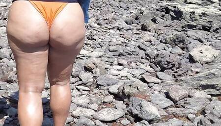 Chubby girl slacking off and walking on the beach