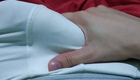 In bed under the blanket wearing white underwear masturbating his big thick cock very hard drooling very horny