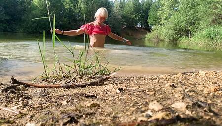 Slow motion jumping in lake in clothes. wet and fun