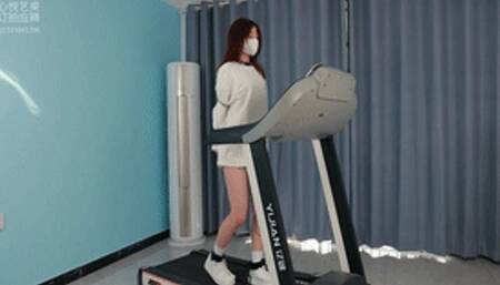 xy150-Chinese girl in handcuffs and shackles walks on a treadmill