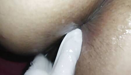My neighbor makes me moan when he examines my anus with his delicious fingers with latex and lubricant