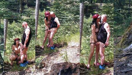 Milf woman with big tits jerking fat dick in the woods