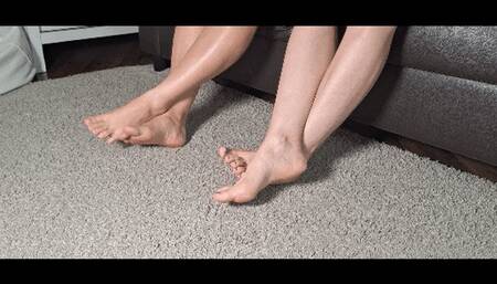 Rubbing feet crossed at the ankles F
