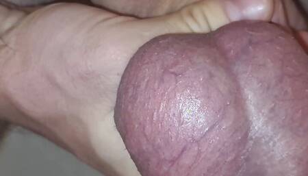 Cum from cock shaking closeup glans