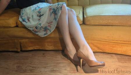 Fifi dangling her brown leather heels while simultaneously stripping off her nude thigh high nylons