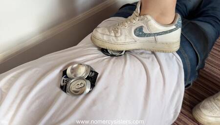 Sisters crushing cans on our human doormat