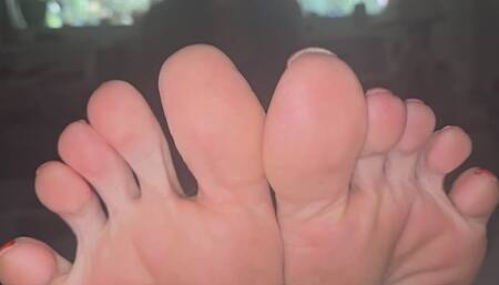 Toe curling and spreading in red polish