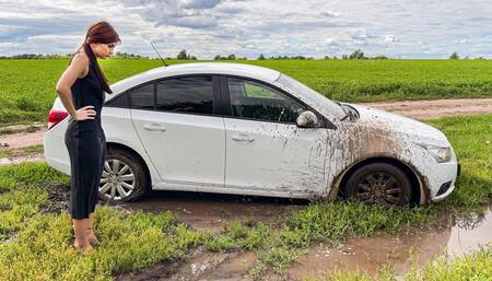 CAR STUCK Ellie got stuck in the mud when she tried to turn around