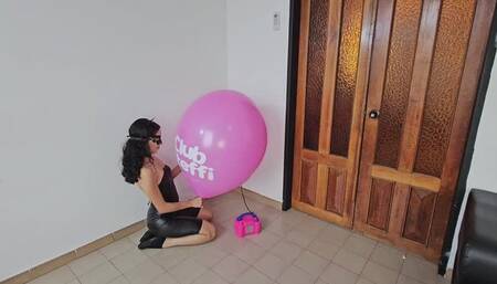 Marianna blows to pop her big pink TIFFANY balloon!