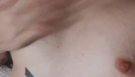 Fairy skin tattooed girl covering her big boobs in saliva