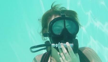 Sophia practices blowing out the FullFaceMask