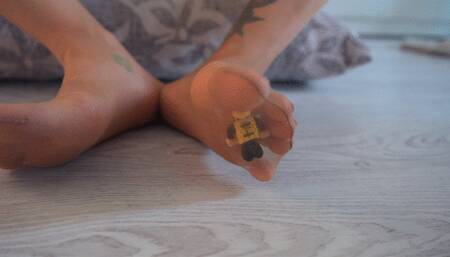 Tiny Slave caught between my nylon stinky feet and toes foot