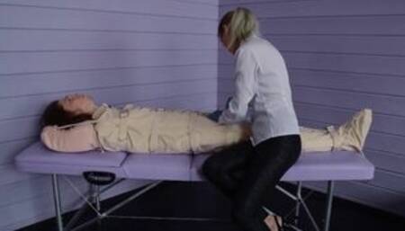 Figging with ginger and Foley bladder catheterization into bondage body bag. Medical play.