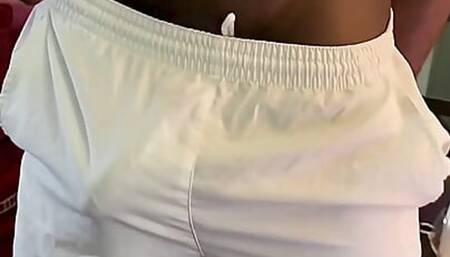 Bulging Around Commando in White Nylon Shorts
