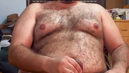 Hairy uncut bear cub gets hard and cums all over his belly and chest
