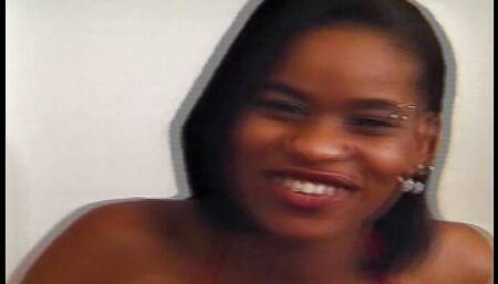 Tattooed ebony masturbates and squirts before getting fucked by her girlfriend with a big strapon