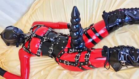 Plugging my rear, clad in latex catsuit with integrated condoms!