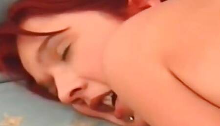 Big ass redhead masturbating with her fingers