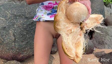 Naked Girl Found a Coconut on a Beach and Poured the Juice Over Her Body