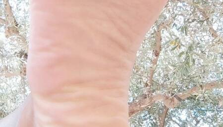 Giantess with her feet up on the table