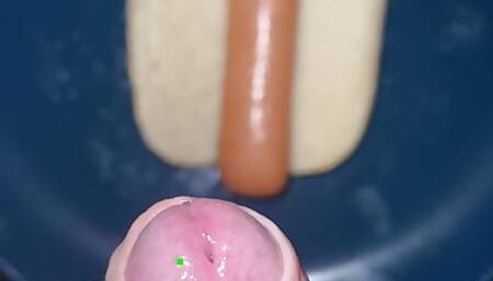 Huge watery cumshot on hotdog
