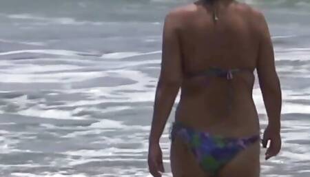 My friend's stepson enjoys me on the beach and cums on my hairy pussy