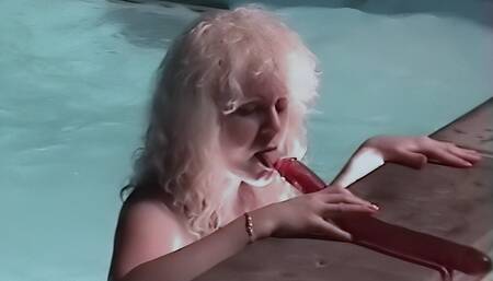 Wet hooker by the pool with a double dildo