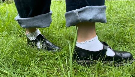 Naughty Amellie gets her feet and socks dirty while walking on the grass