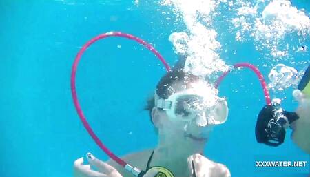 Minnie has fun with Candy underwater
